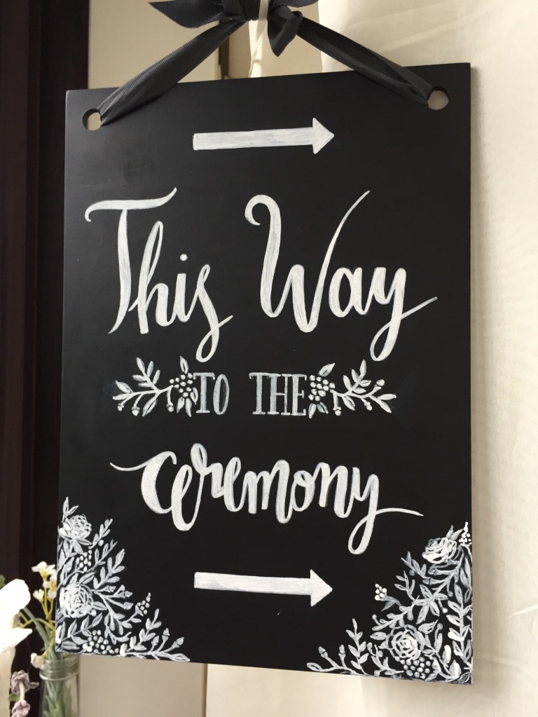 wedding sign direction this way to the ceremony chalk board vines floral